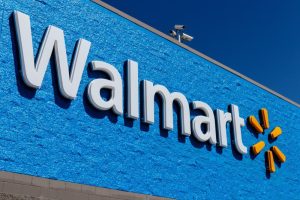 Walmart engineers collaborating with AI-powered agents in a modern tech workspace